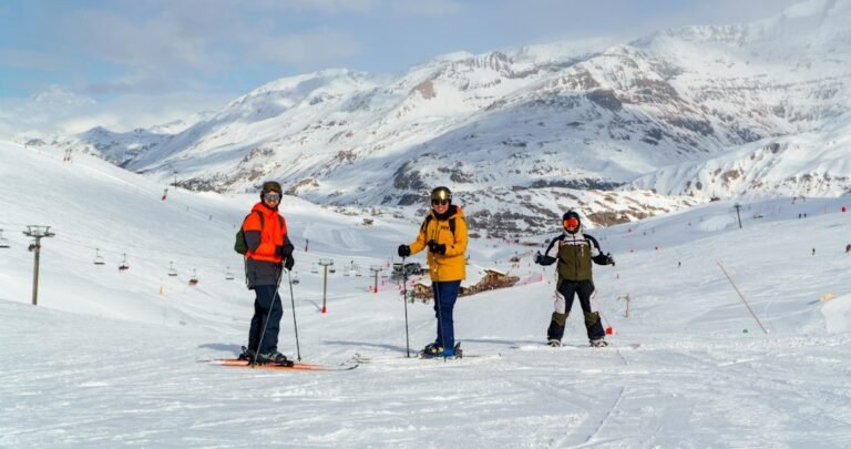 Group of skiers standing together in the mountains