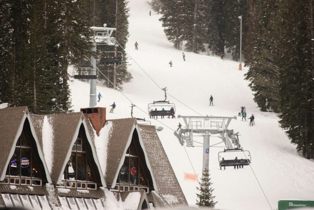 Ski lift ascending a snowy mountain, illustrative photograph