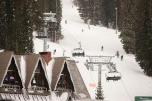 Ski lift ascending a snowy mountain, illustrative photograph