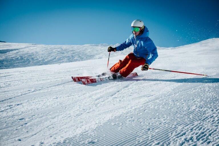 Skiers enjoying a snowy piste, illustrative photograph