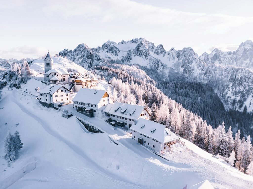 Snow-covered Alpine village with mountain scenery in the Julian Alps
