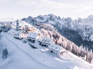 Snow-covered Alpine village with mountain scenery in the Julian Alps