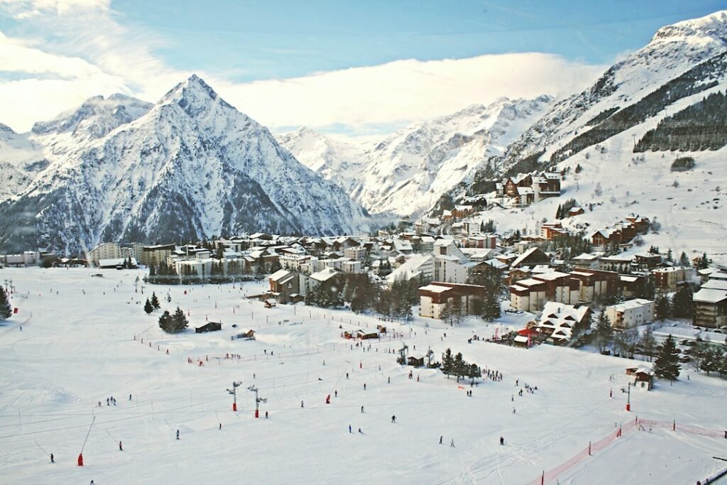 Snowy mountain village and mountains, illustrative winter scenery